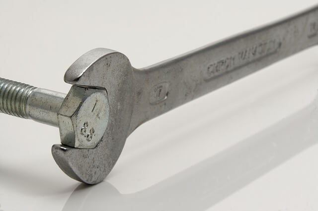 wrench clasped onto a bolt