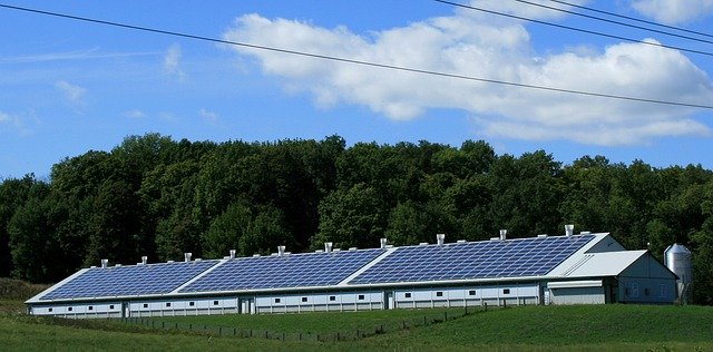 line of giant solar panels out in the wilderness