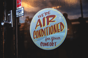 sticker that reads "we're air conditioned for your comfort"